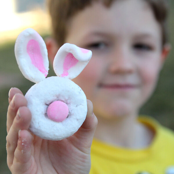 A boy holding a mini donut bunny