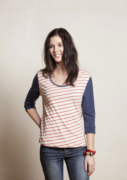Woman wearing long sleeve t-shirt with stripes on the shirt and solid sleeves