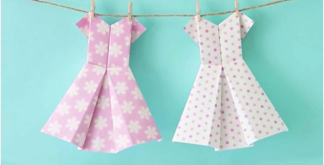 Origami dresses hanging on a clothesline