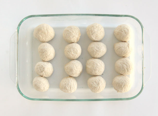 balls of roll dough in a 9x13 pan
