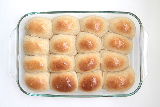 Golden brown dinner rolls in a 9x13 baking dish