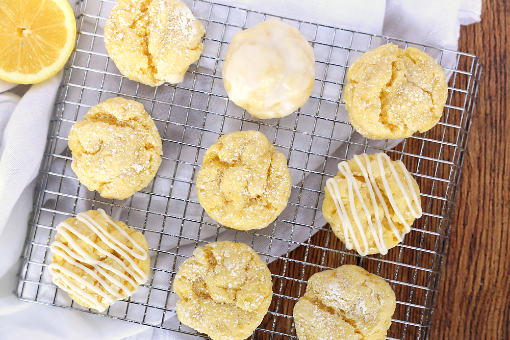 Lemon cookies on a cooking rack, some with glaze