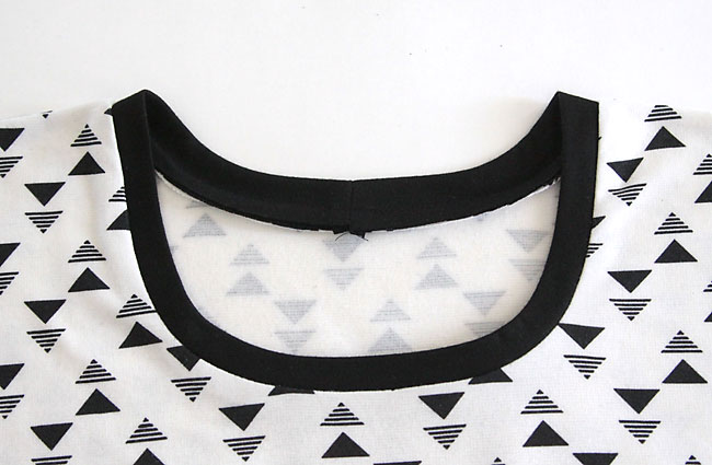 Black neckbinding sewn into t-shirt