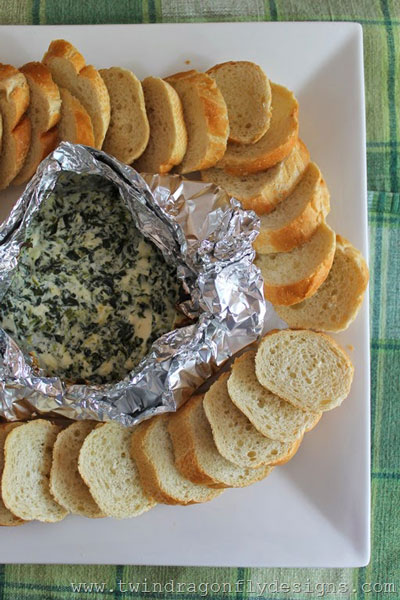 Spinach dip in a foil packet with bread slices