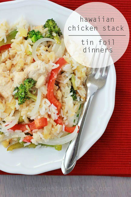 Hawaiian chicken stacking tin foil dinner on a plate with rice peppers and broccoli