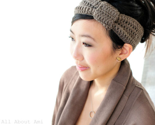 A person wearing a crocheted headband