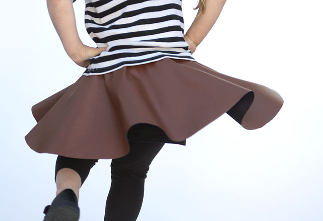A girl twirling in a circle skirt
