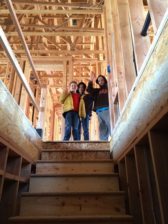 kids inside a house that\'s being built