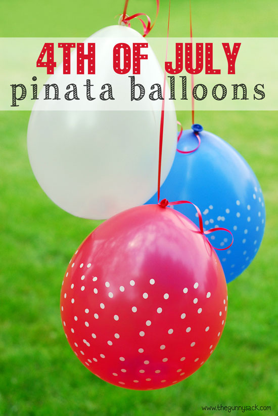 Red white and blue balloons hanging above the grass