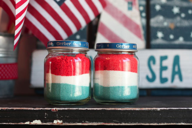 Craft jars filled with red white and blue sand