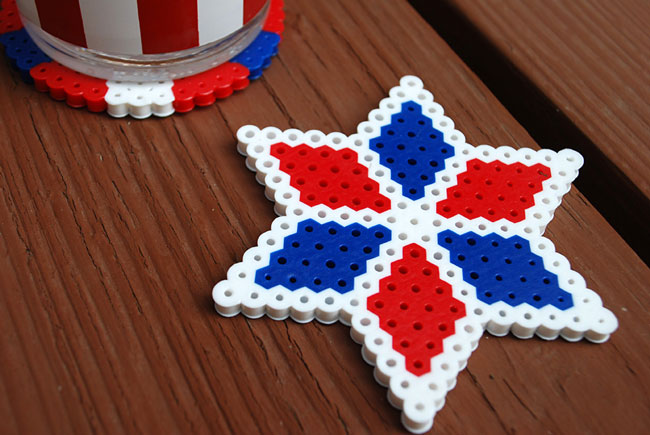 Star shaped coaster made from red white and blue Perler beads for 4th of July craft for kids