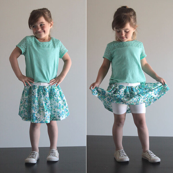 A little girl wearing a skirt with attached shorts