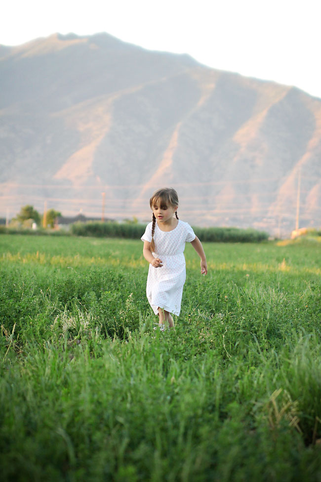 A little girl playing in a field