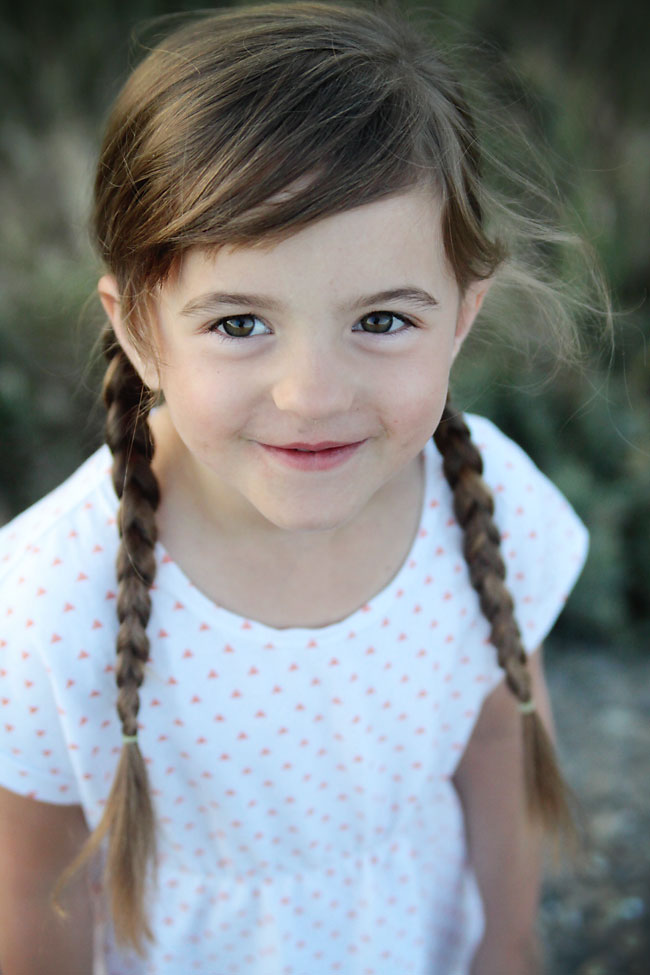 A little girl smiling at the camera