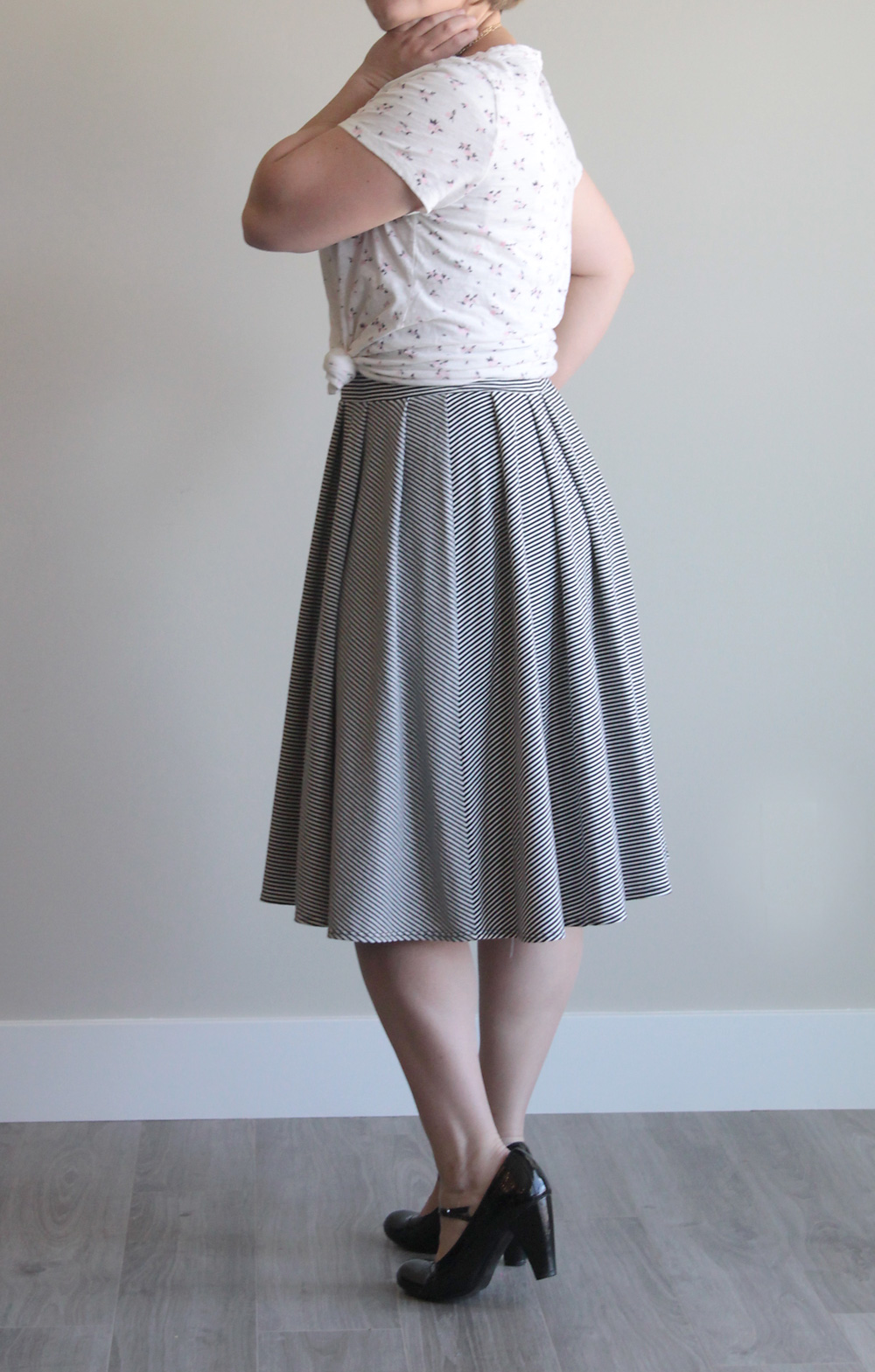 Woman wearing pleated midi length skirt