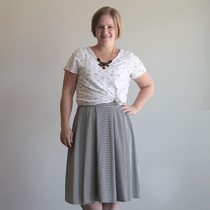 Woman wearing pleated midi length skirt