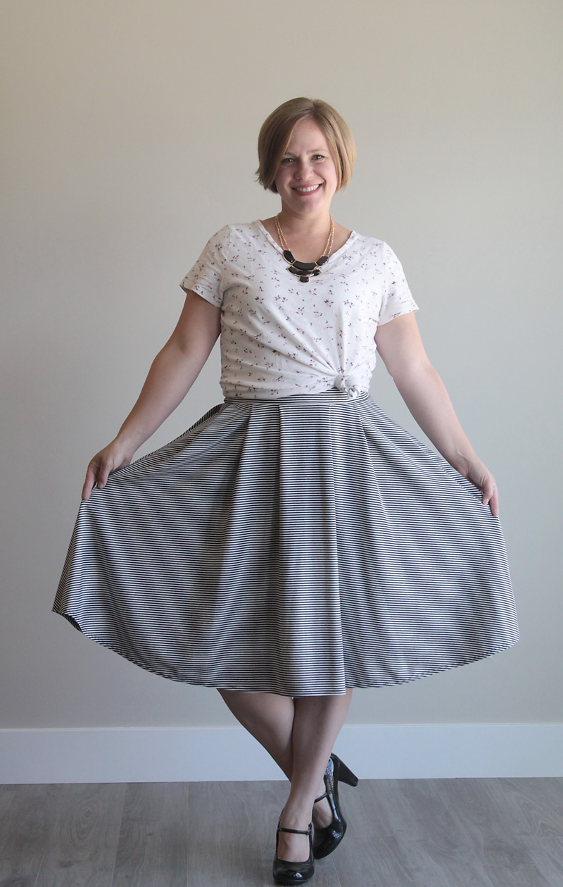 Woman wearing pleated midi length skirt