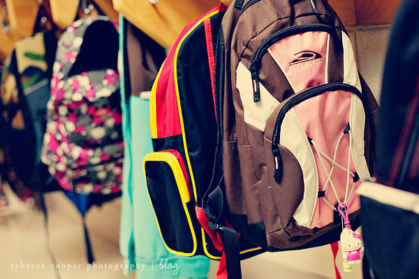 Backpacks hanging on a wall