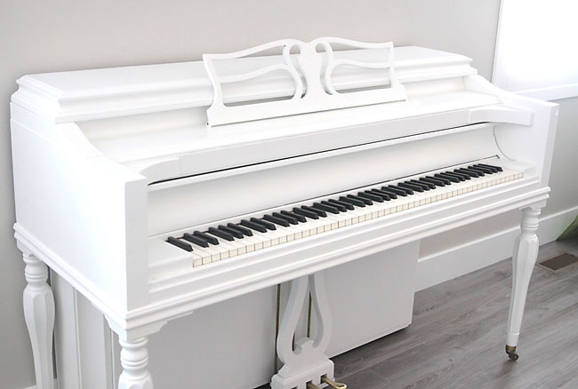 A piano that\'s been painted white