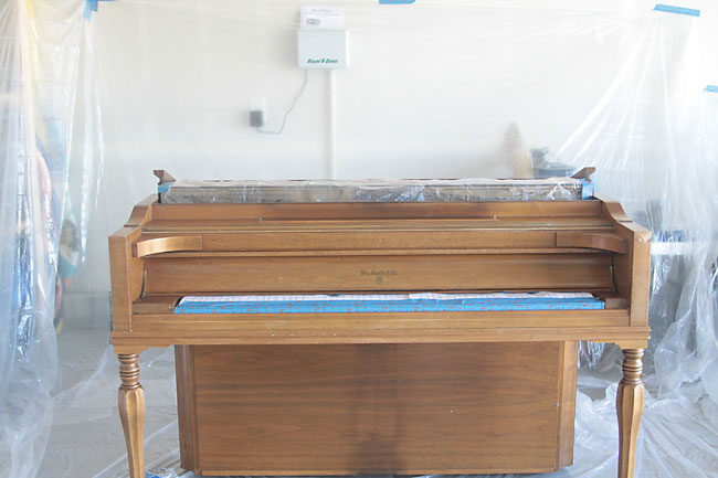 piano taped off and ready to paint