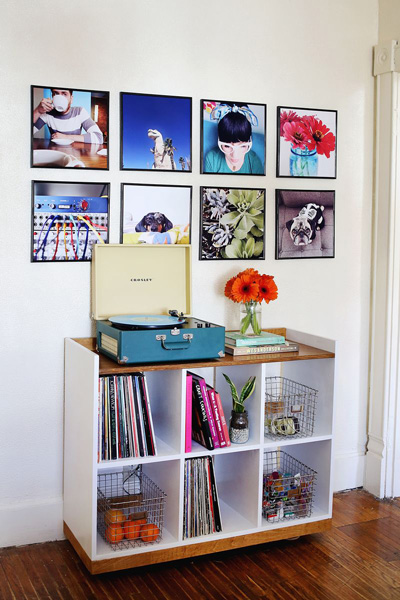 Large photos in record frames on a wall