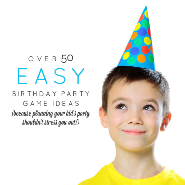 A young boy wearing a birthday hat and smiling at the camera