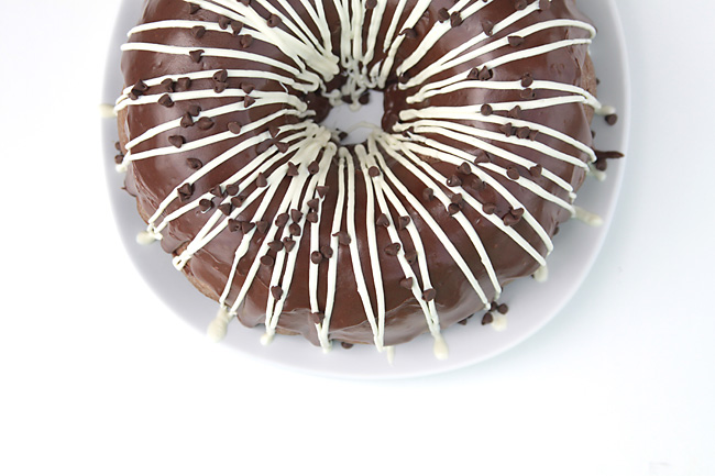 Chocolate bundt cake with white drizzled frosting