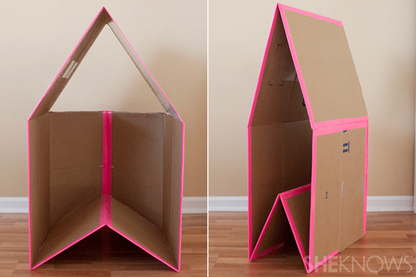 A collapsible play house made from a large cardboard box and duct tape