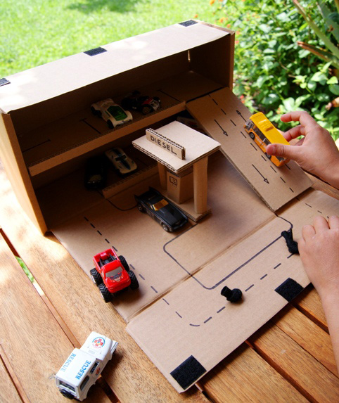 A cardboard garage for toy cars