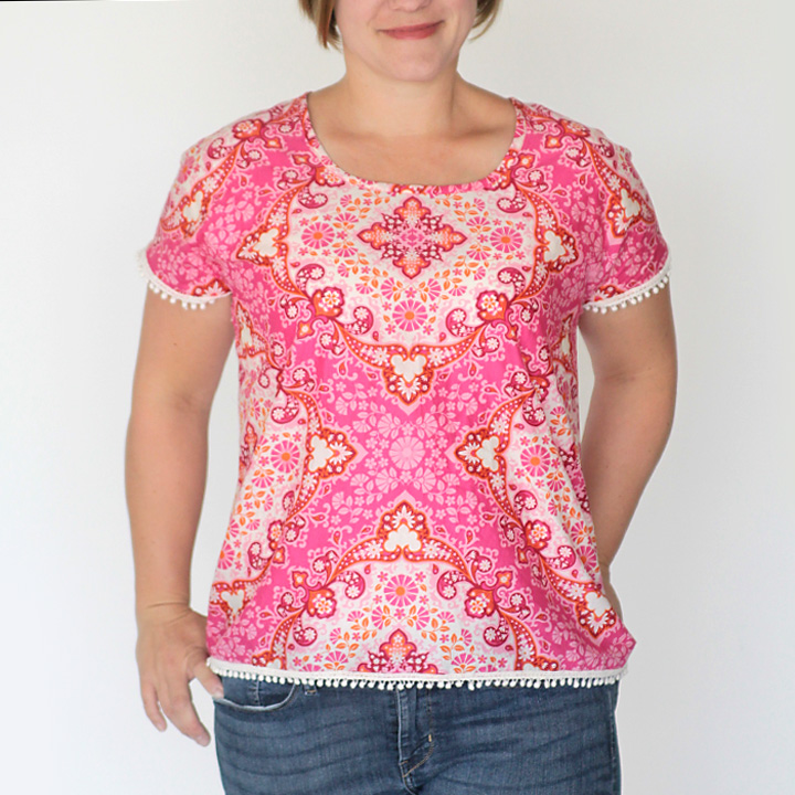 Woman in an easy to sew pink blouse