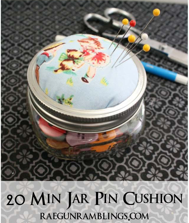 Small mason jar filled with buttons and with a pincushion on top for a DIY gift