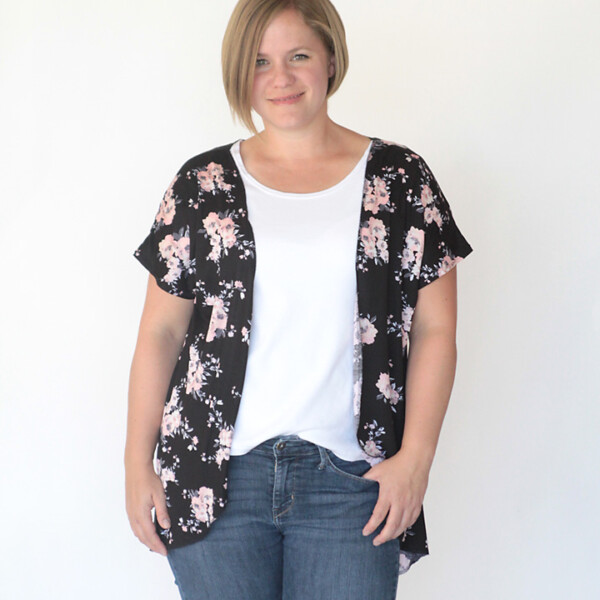 A woman wearing an open t-shirt shawl