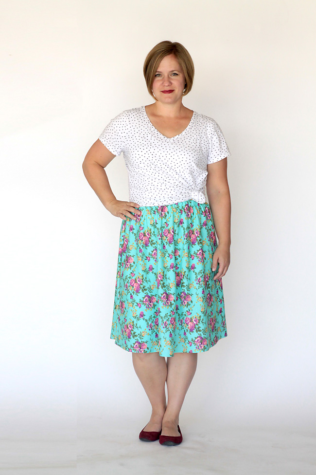 A woman in a t-shirt and skirt made from a sewing tutorial