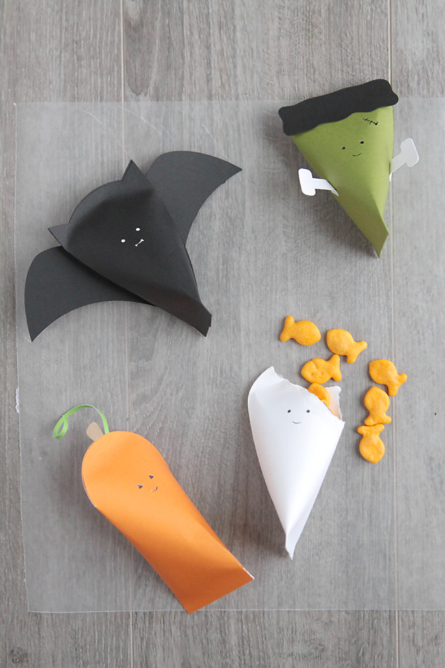 paper halloween character boxes with goldfish crackers in them