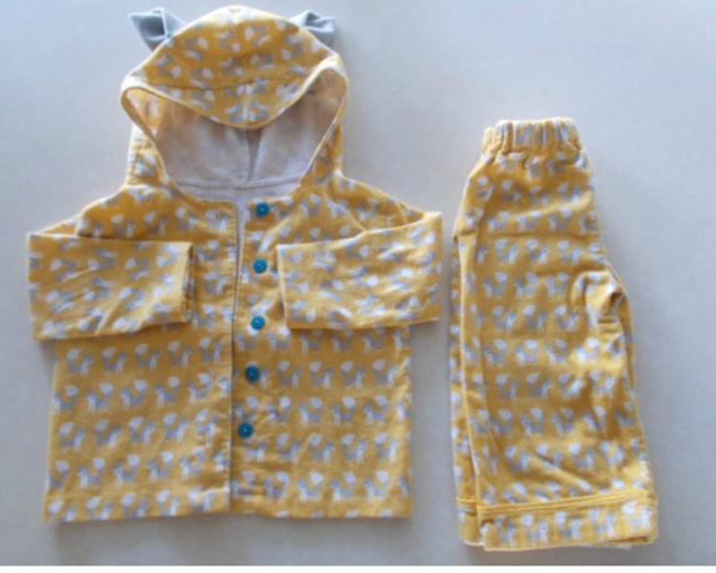 Little kid pajamas made from yellow fabric