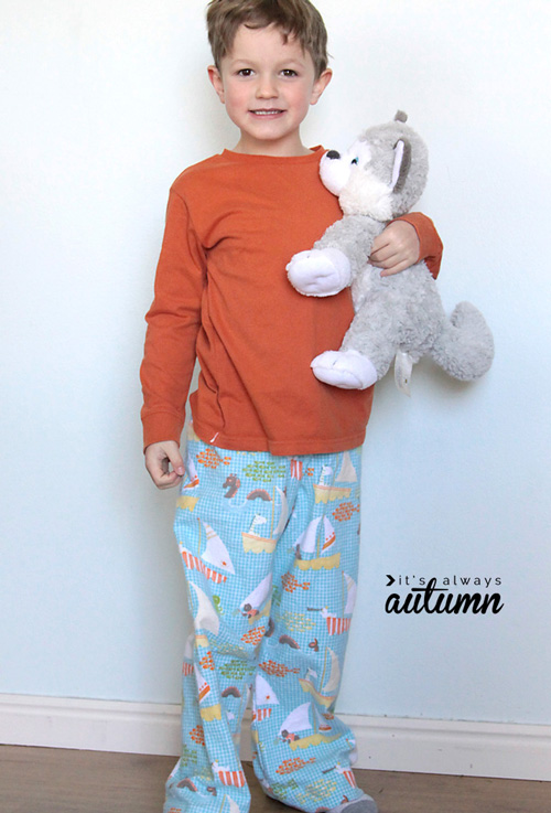 A little boy wearing pajamas made from a free sewing tutorial