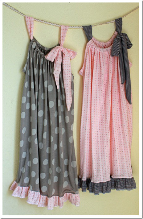 Pillowcase style nightgowns hanging on a wall