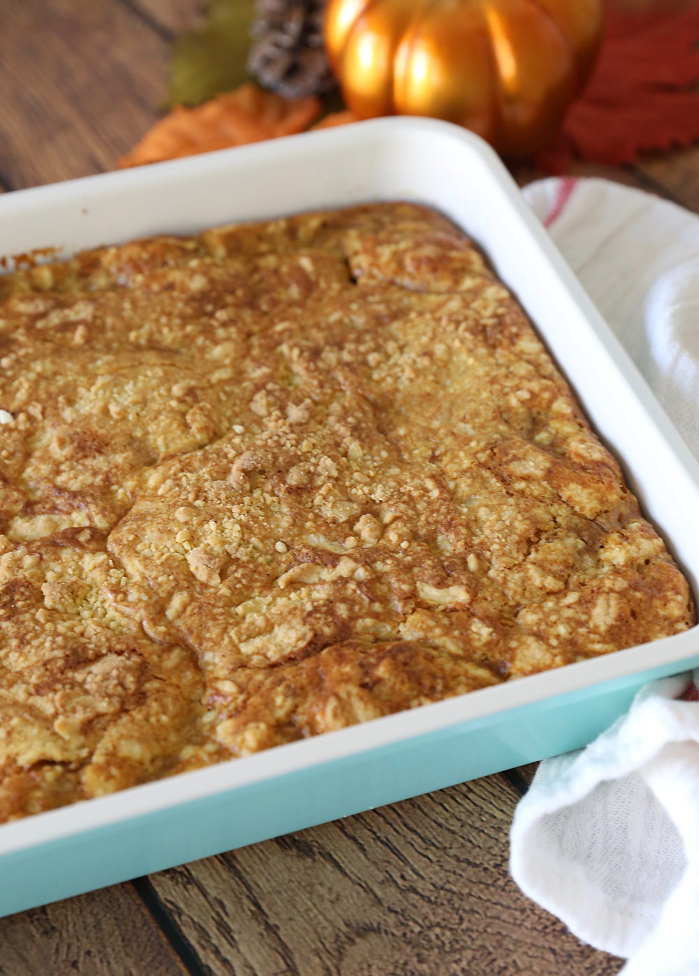 Pumpkin pie cake in a light blue 9x13 pan