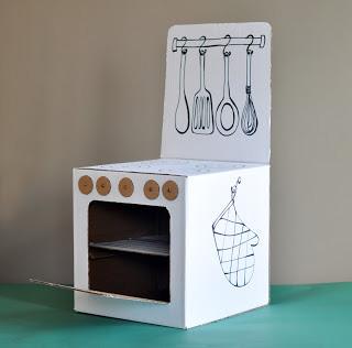 Play kitchen made from a large cardboard box