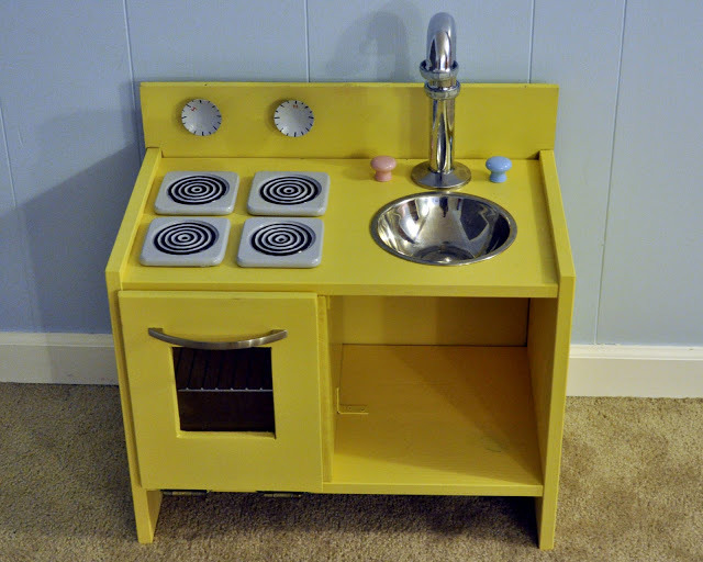 Bright yellow Play Kitchen made from a nightstand
