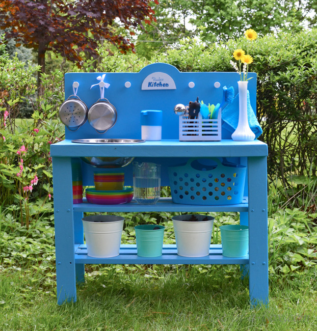 Old shelf turned into toy kitchen, outside in the yard