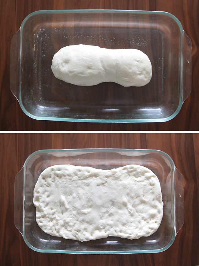 A loaf of frozen bread dough in a 9x13 pan, thawed dough pressed out to fill 9x13 pan
