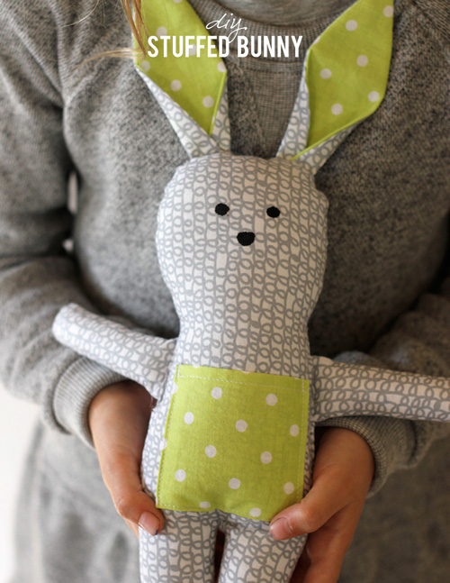 DIY stuffed bunny made from grey and green fabric