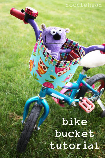 Fabric bike basket with toy in it