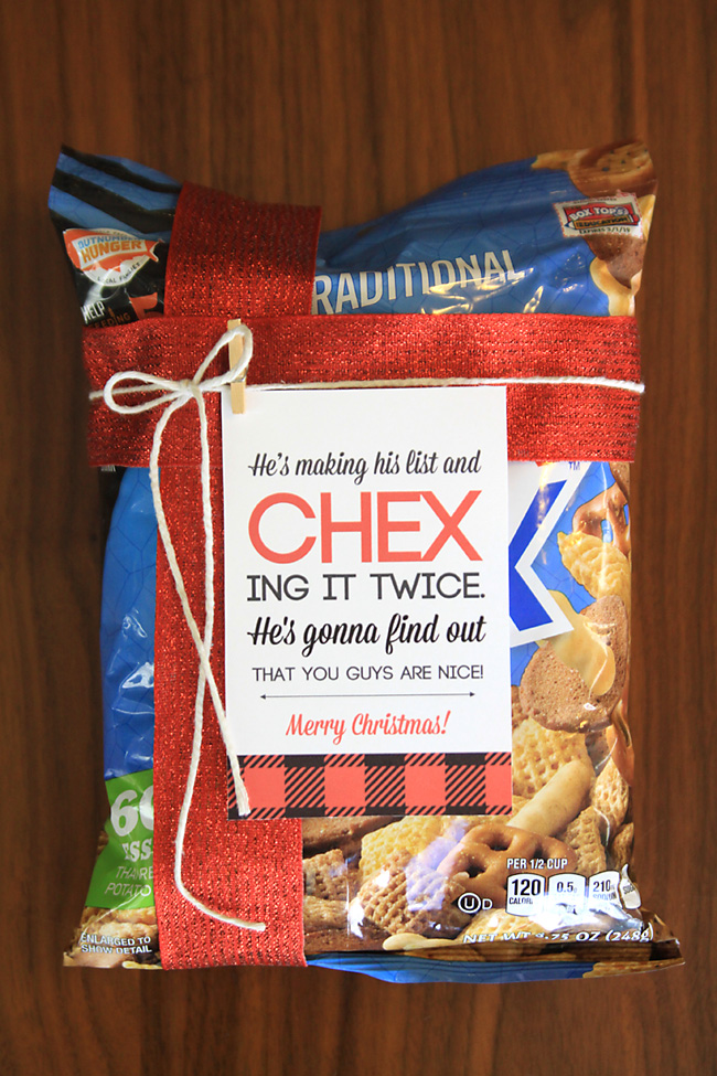 Package of chex mix tied with ribbon and tag that says He\'s making his list and CHEX ing it twice