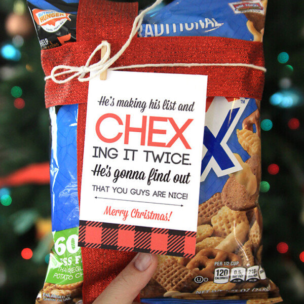 Package of Chex Mix with ribbon and Christmas tag