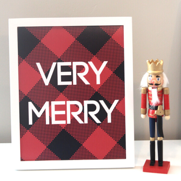 Christmas print with words Very Merry on red and black plaid background