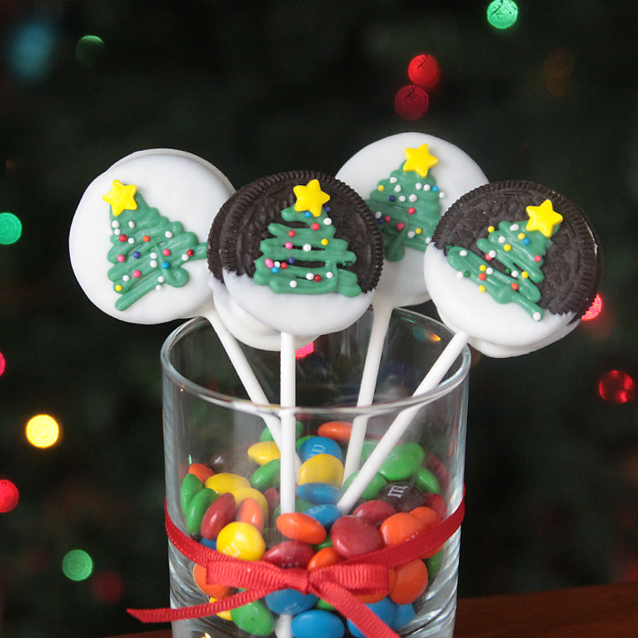 Christmas tree Oreo pops in a vase full of M&Ms