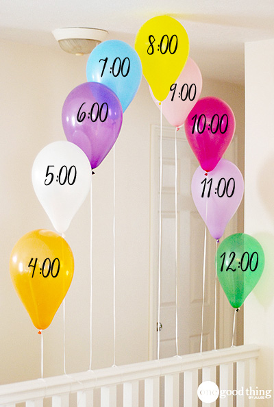 Balloons with different hours written on them to count down on New Year\'s Eve