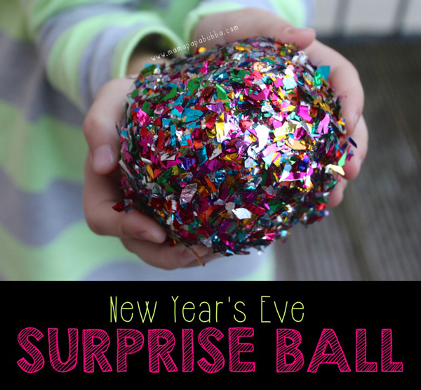 Kid\'s hands holding sparkly surprise ball for New Year\'s Eve